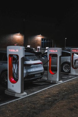 Sandefjord, Norway - februar 25, 2022: Silver Mercedes EQC Parked At Tesla Supercharger Station. The Mercedes EQC Is A Full-sized All-electric Five-door SUV