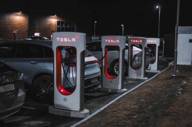 Sandefjord, Norway - februar 25, 2022: Silver Mercedes EQC Parked At Tesla Supercharger Station. The Mercedes EQC Is A Full-sized All-electric Five-door SUV