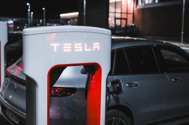 Sandefjord, Norway - februar 25, 2022: Silver Mercedes EQC Parked At Tesla Supercharger Station. The Mercedes EQC Is A Full-sized All-electric Five-door SUV