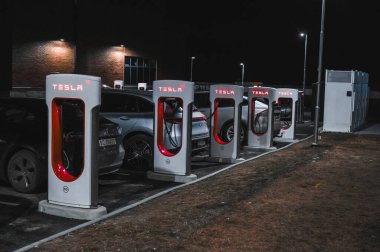 Sandefjord, Norway - februar 25, 2022: Silver Mercedes EQC Parked At Tesla Supercharger Station. The Mercedes EQC Is A Full-sized All-electric Five-door SUV