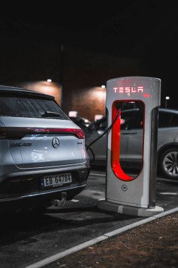 Sandefjord, Norway - februar 25, 2022: Silver Mercedes EQC Parked At Tesla Supercharger Station. The Mercedes EQC Is A Full-sized All-electric Five-door SUV
