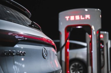 Sandefjord, Norway - februar 25, 2022: Silver Mercedes EQC Parked At Tesla Supercharger Station. The Mercedes EQC Is A Full-sized All-electric Five-door SUV