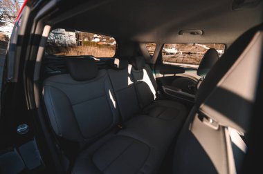 Tonsberg, Norway - April 06, 2022: black red Kia Soul is a compact C-segment electric car. New car on a sunny day close to the sea