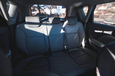 Tonsberg, Norway - April 06, 2022: black red Kia Soul is a compact C-segment electric car. New car on a sunny day close to the sea