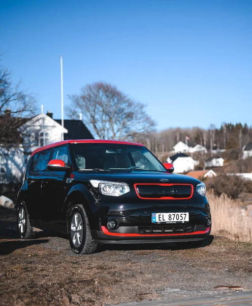 Tonsberg, Norway - April 06, 2022: black red Kia Soul is a compact C-segment electric car. New car on a sunny day close to the sea