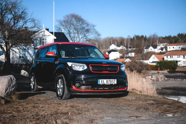 Tonsberg, Norway - April 06, 2022: black red Kia Soul is a compact C-segment electric car. New car on a sunny day close to the sea