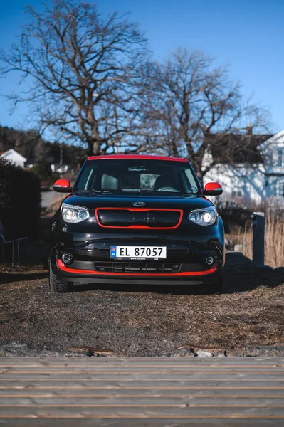 Tonsberg, Norway - April 06, 2022: black red Kia Soul is a compact C-segment electric car. New car on a sunny day close to the sea