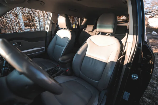 Tonsberg, Norway - April 06, 2022: black red Kia Soul is a compact C-segment electric car. New car on a sunny day close to the sea