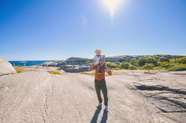 Noway, Verdens Ende Tjome summer view point tourist place in Vestfold. Grandpa with grandkid cute boy. happy childhood