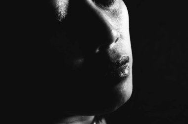 Black and white close-up image of an Indonesian woman