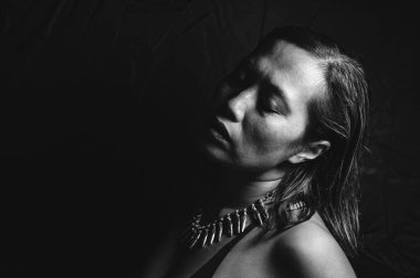 Black and white close-up image of an Indonesian woman