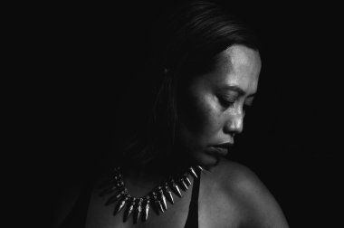Black and white close-up image of an Indonesian woman