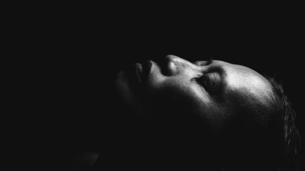 Black and white close-up image of an Indonesian woman