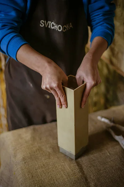 the process of making a rectangular candle from cement, small business concept at home, taking out a large candle from a rectangular shape