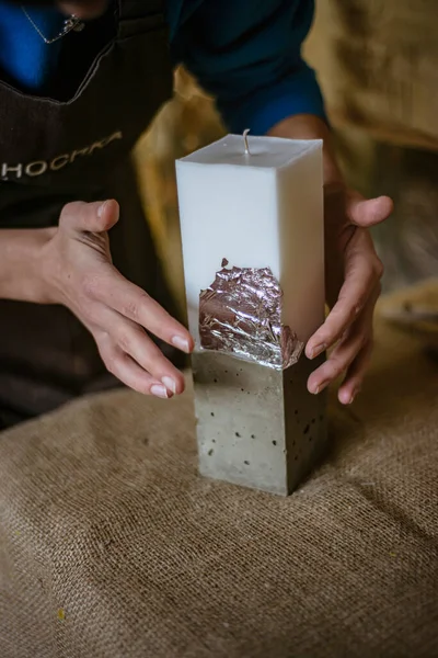 process of making a rectangular candle from cement, small business concept at home, silver leaf on candles