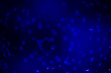 mavi bokeh çözünmüş simler, koyu arkaplanda lacivert bokeh ile soyut arkaplan.