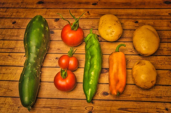 Own harvested healthy fresh vegetable, balcony garden produce, clean eating and dieting concept on a wooden background