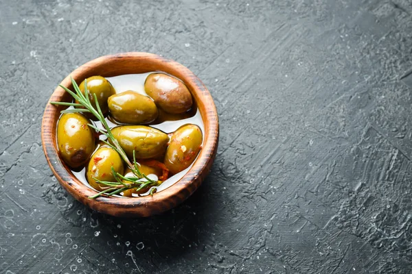Marinated Olives Wooden Bowl Stone Background Free Space Text — стоковое фото