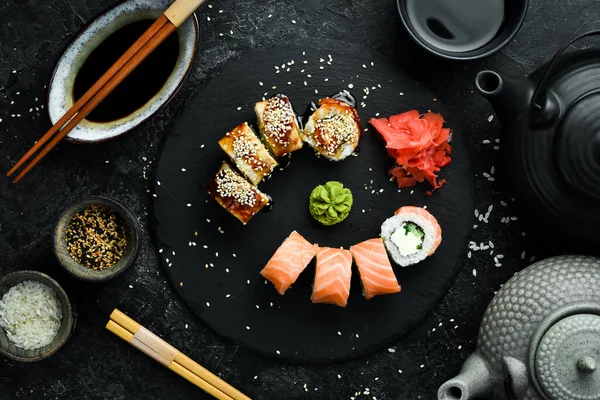 Traditional sushi rolls on a stone plate. Close-up. Sushi menu. Japanese food.