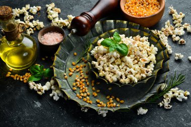 Popcorn on kitchen table. Top view. On a stone table.