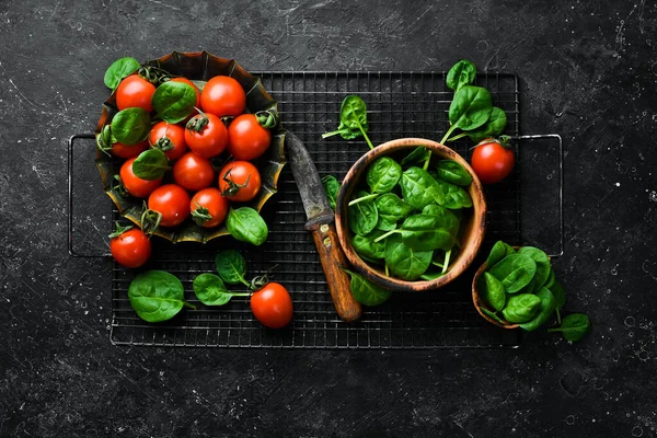 Fresh Cherry Tomatoes Green Spinach Leaves Top View Stone Background — Stock Photo, Image