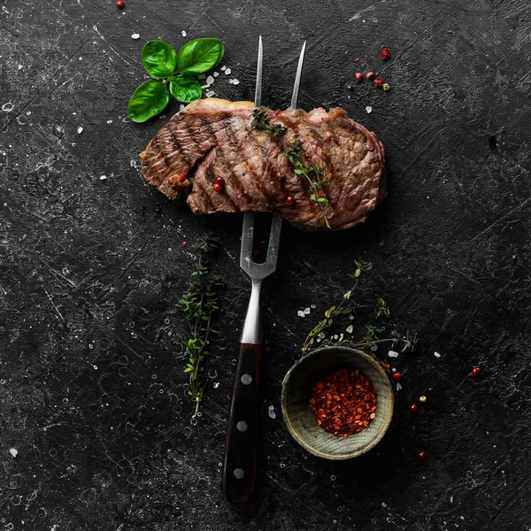 Grilled Rib Eye Steak Herbs Spices Black Stone Background — Stock Photo, Image