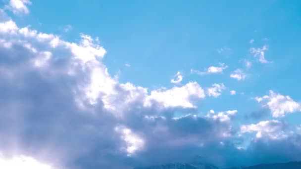 Moving white clouds on the blue sky in time laps — Stockvideo
