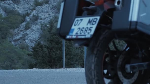 Motorcycle tourist man riding stops on modern adventure motorbike — Videoclip de stoc