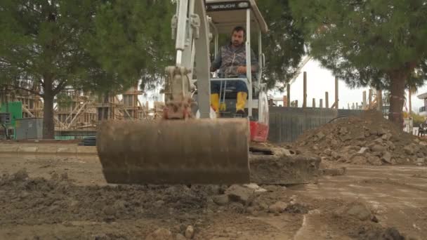 Excavator clearing road — Stockvideo