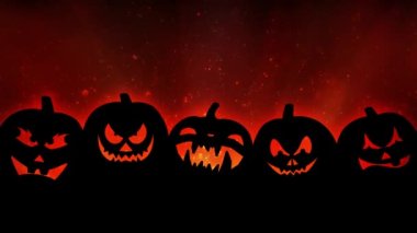 Turuncu 4K döngüsündeki Jack O Lantern silueti beş Jack O Fenerinin siluetini ve turuncu parçacık arkaplanını bir döngüde gösterir.