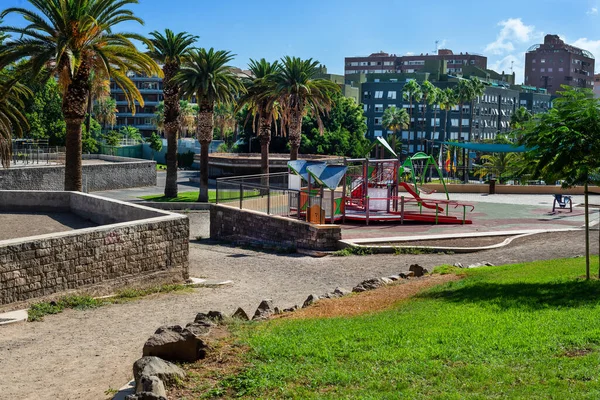 Public park with games for children on a sunny day in Tenerife. Canary Islands. Spain
