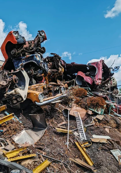 A pile of Soviet cars at a scrap metal dump.