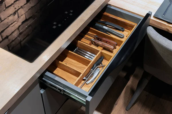 Modern kitchen. Set of cutlery trays in kitchen drawer. Solid oak wood cutlery drawer inserts.