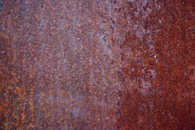 Eski paslı metal bir duvar. Arka plan için güzel bir doku. Yakın plan..
