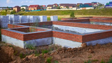 Concrete foundation for the construction of a brick country house.