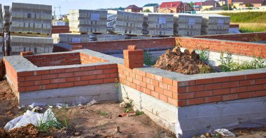 Concrete foundation for the construction of a brick country house.