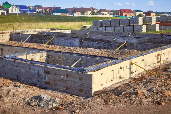 Pile foundation for the construction of a frame country house.