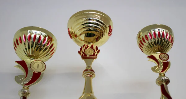Golden Sports Cups Winning Competitions Shelf — стоковое фото