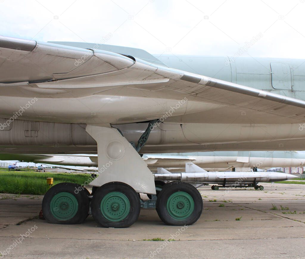 Old Supersonic anti-ship missiles near the chassis of a strategic bomber