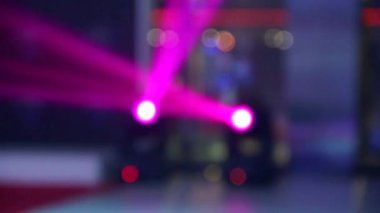 Stage lighting equipment. Moving colored spotlights illuminate the party with multi-colored beams with soft focus