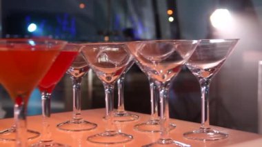 Cocktail bar with glasses and shot drinks at a party hall with festive lighting set of video footages