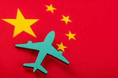 Model of a symbolic aircraft against the background of the Chinese flag