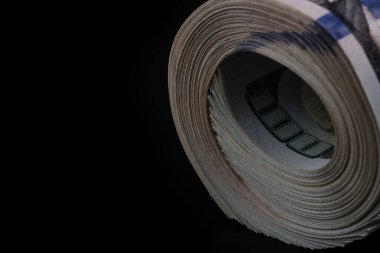Stack of American dollars on a black background