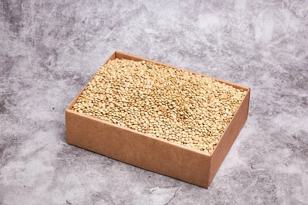 Cardboard Box Dried Green Lentils Gray Stone Background Healthy Vegan — стоковое фото