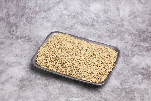 Dried Green Lentils Black Tray Gray Stone Background Healthy Vegan — стоковое фото