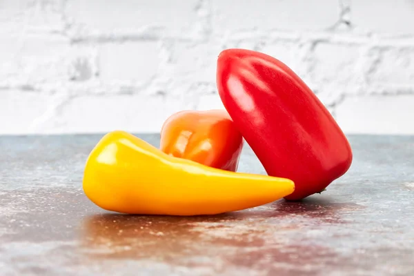 Three Small Red Yellow Orange Peppers Vegan Vegetarian Food Healthy — Fotografia de Stock