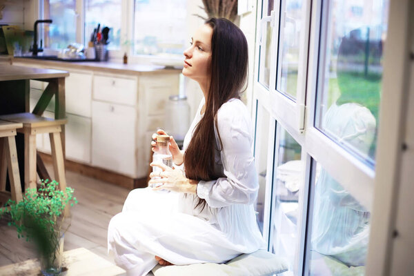 Beautiful athletic girl doing yoga exercises enjoy meditation at home. No stress, healthy habit, anxiety relief concept. Lotus.