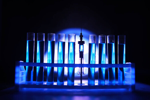 Test tube of glass overflows new liquid solution potassium blue conducts an analysis reaction takes various versions reagents using chemical pharmaceutics cancer manufacturing 