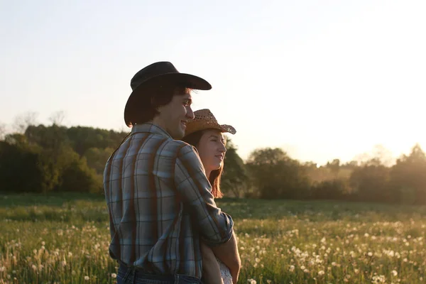 Cute couple on a walk by the countryside summer