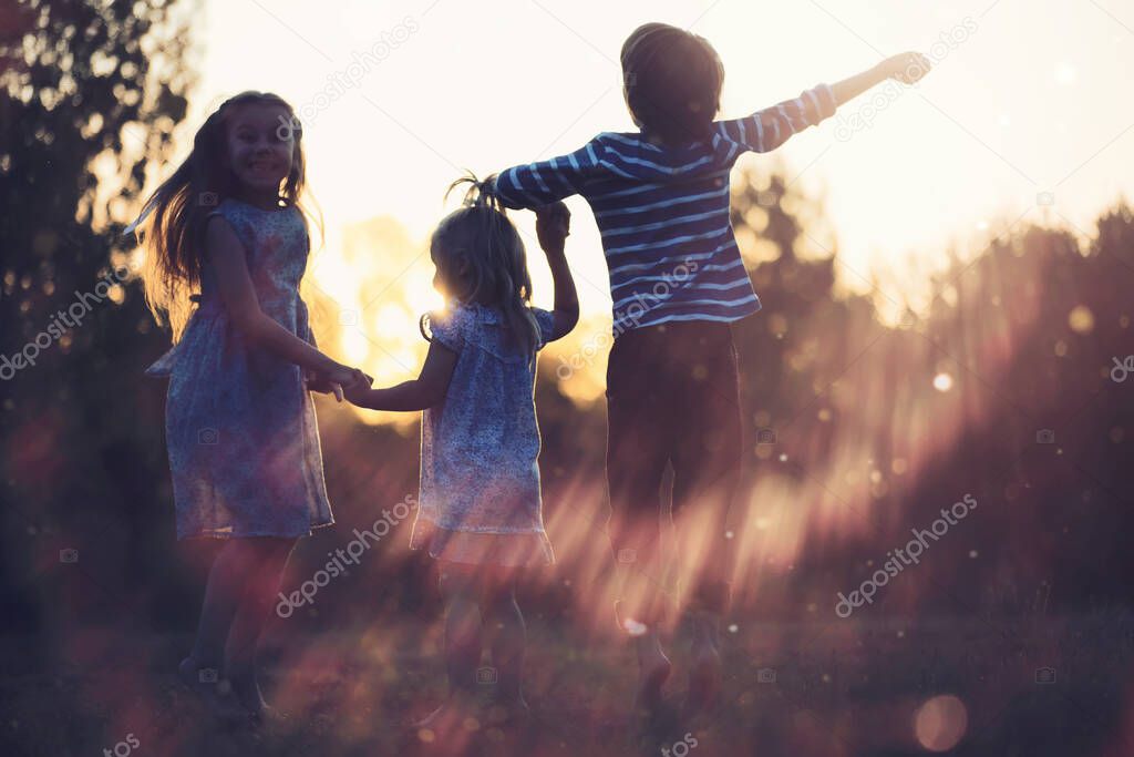 Children walk in the summer in nature. Child on a sunny spring morning in park. Traveling with children.